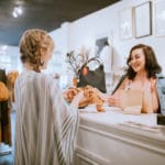 Latina Boutique Store Owner At Checkout Counter